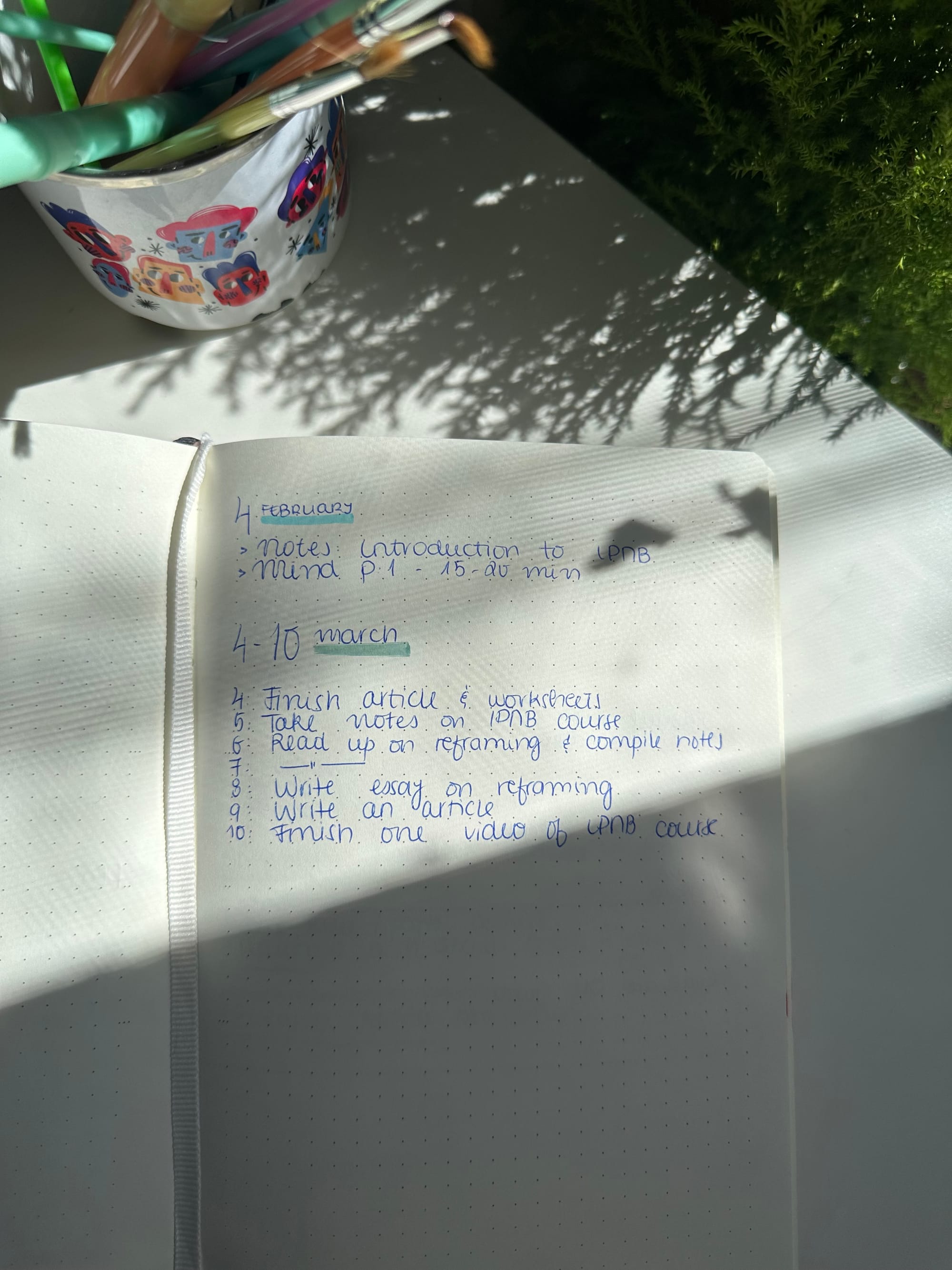 Weekly to-do list on sunny desk